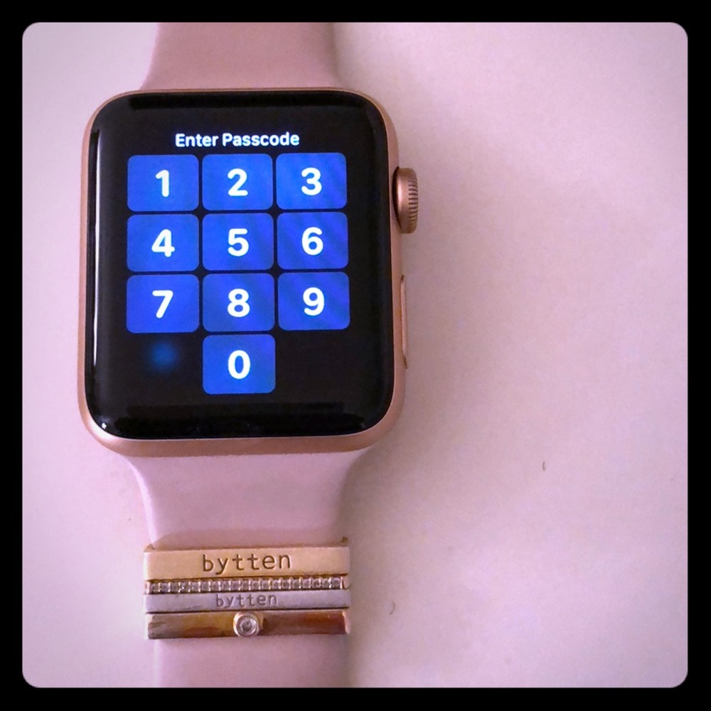 Rose gold Apple Watch series 3 w/ bytten charms.
